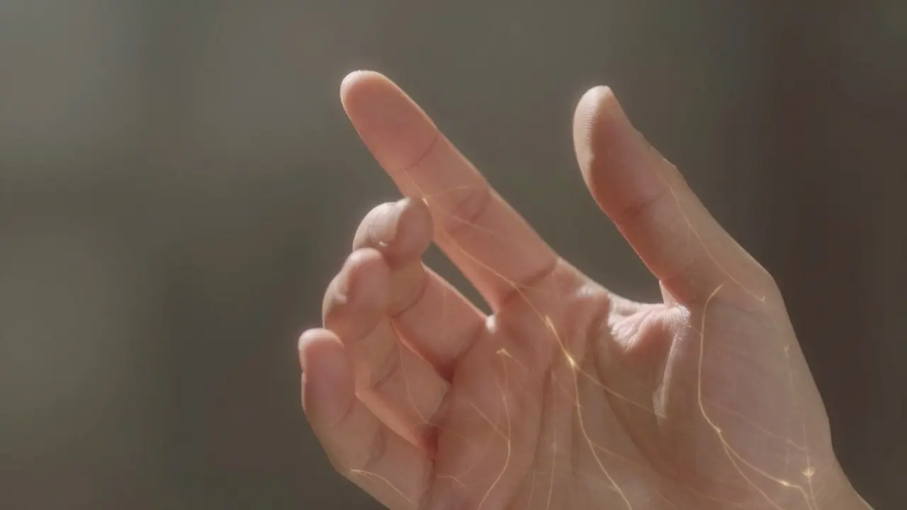 Close-up of a hand pressing firmly on the acupressure point between thumb and index finger, with subtle energy lines.